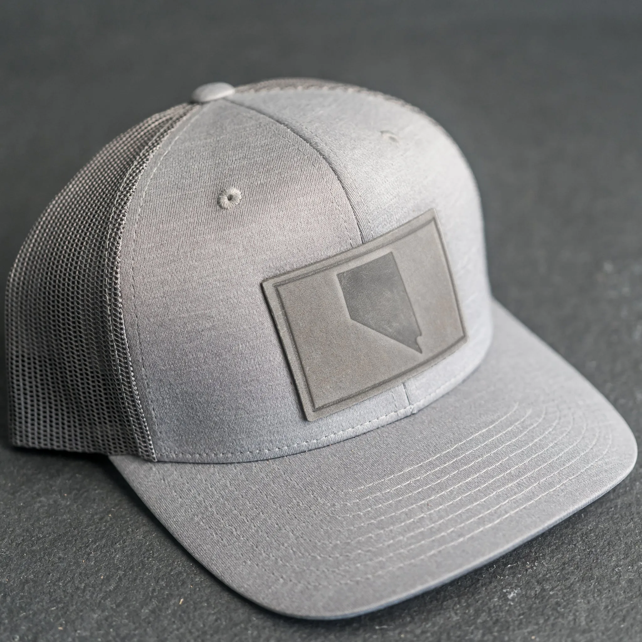 Leather Patch Performance Style Trucker Hat - Nevada Stamp