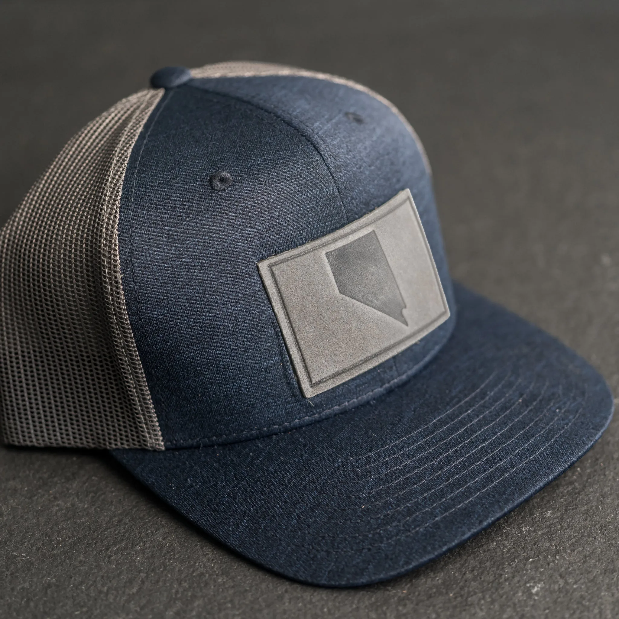 Leather Patch Performance Style Trucker Hat - Nevada Stamp