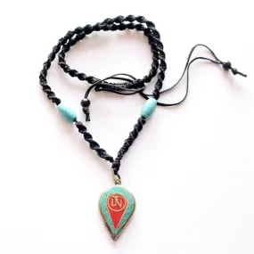 Turquoise and Coral Inlaid Leaf Tibetan Om Pendant