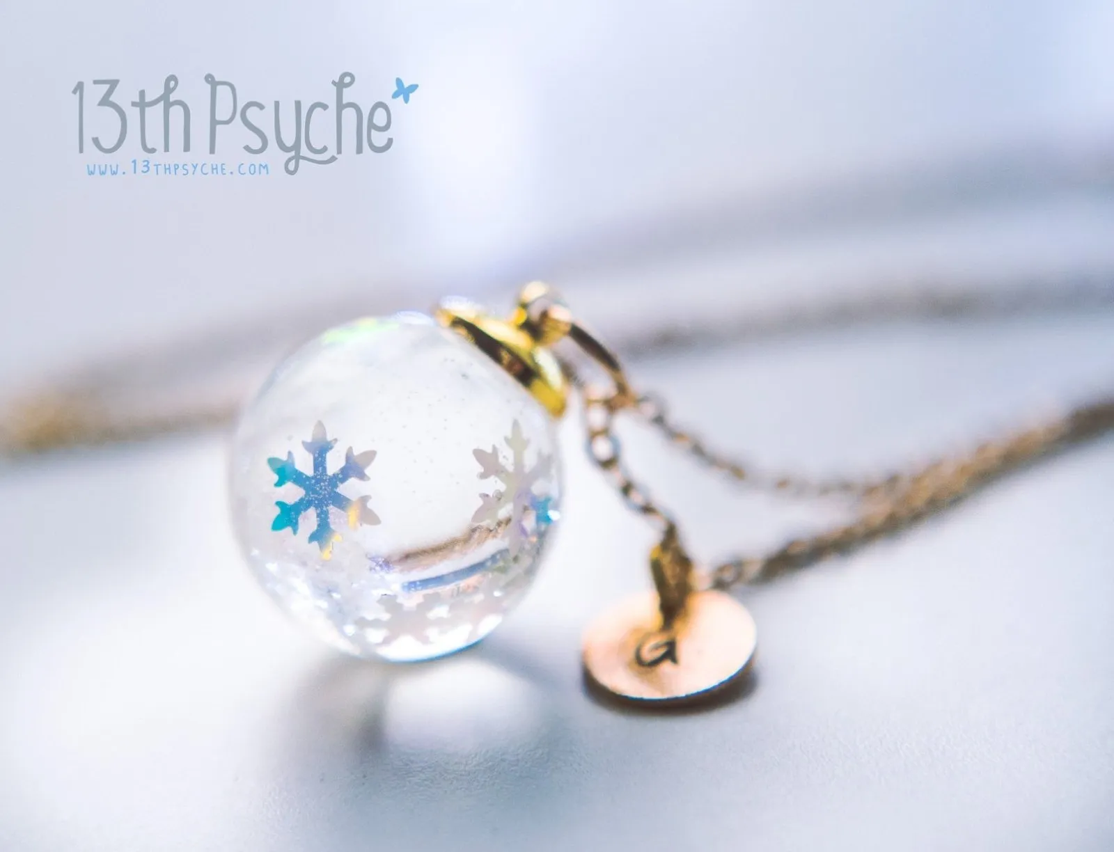 Winter inspired snowflake resin ball necklace